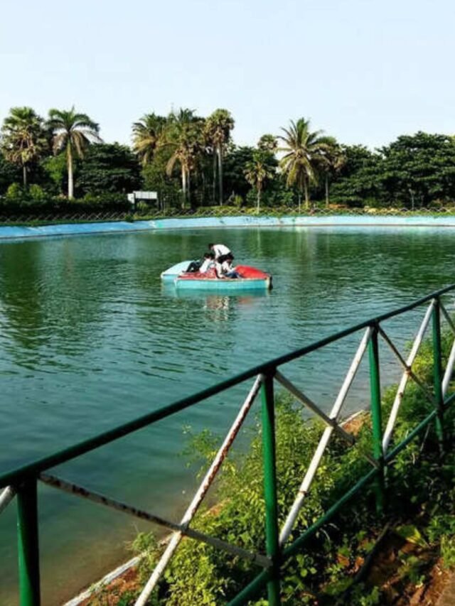 Couple walking hand-in-hand on Yarada Beach, Visakhapatnam