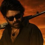 Pawan Kalyan in OG Movie stylish look with gun on shoulder during mass action sequence