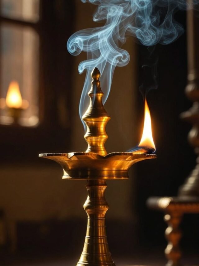 Brass oil lamp flame going out inside a traditional Indian home temple