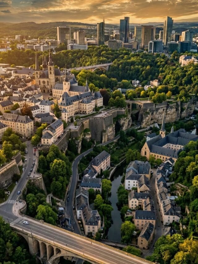 Aerial panoramic view of Luxembourg City skyline with historic fortifications and modern buildings